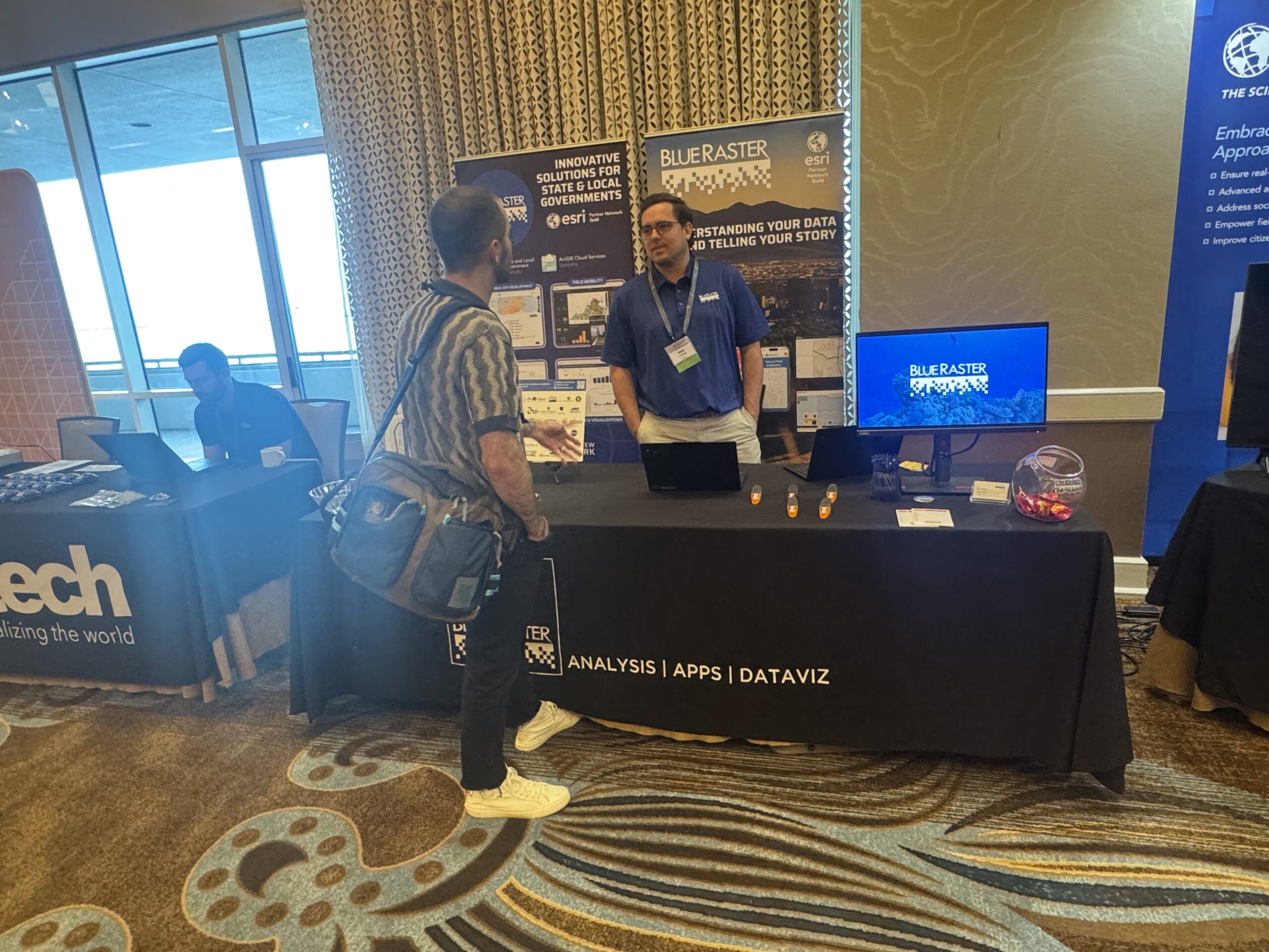 Blue Raster Project Manager, Nate Lickteig interacting with SCAUG participants at the Blue Raster booth